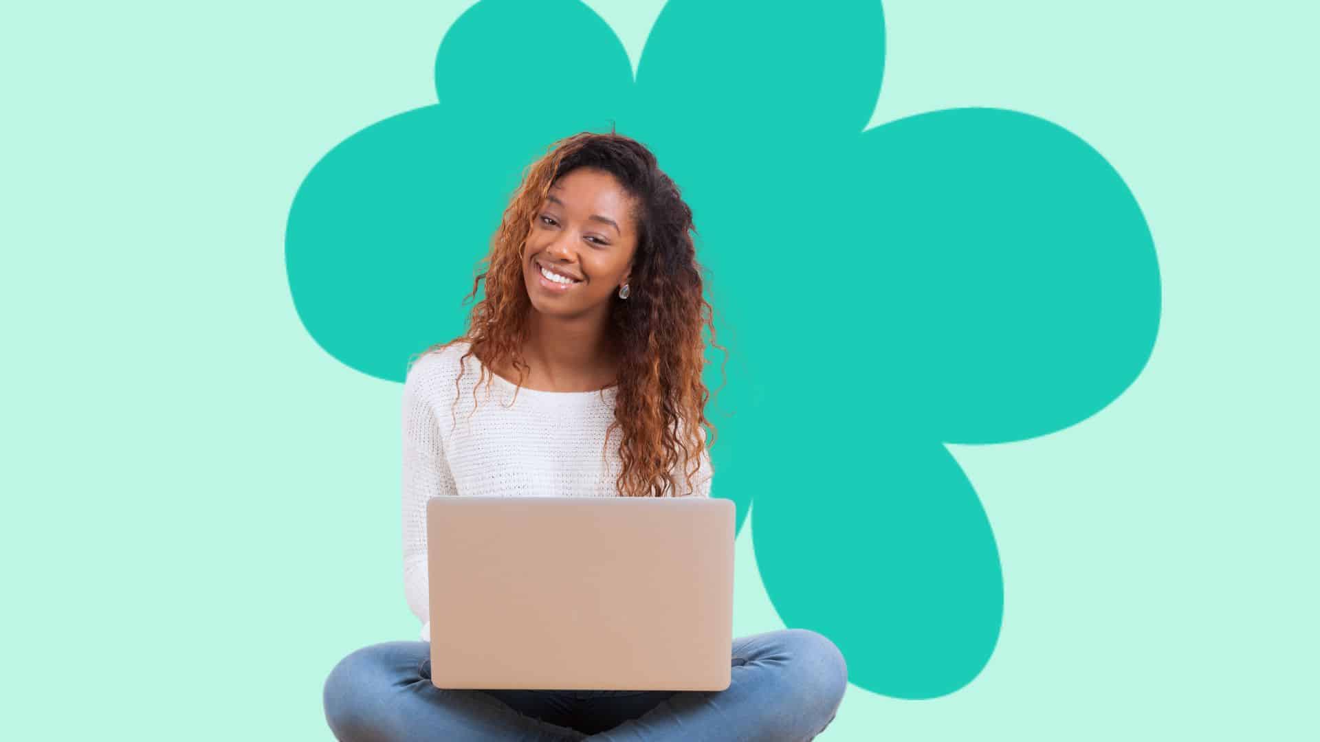 Girl sitting at computer about to attend online therapy session